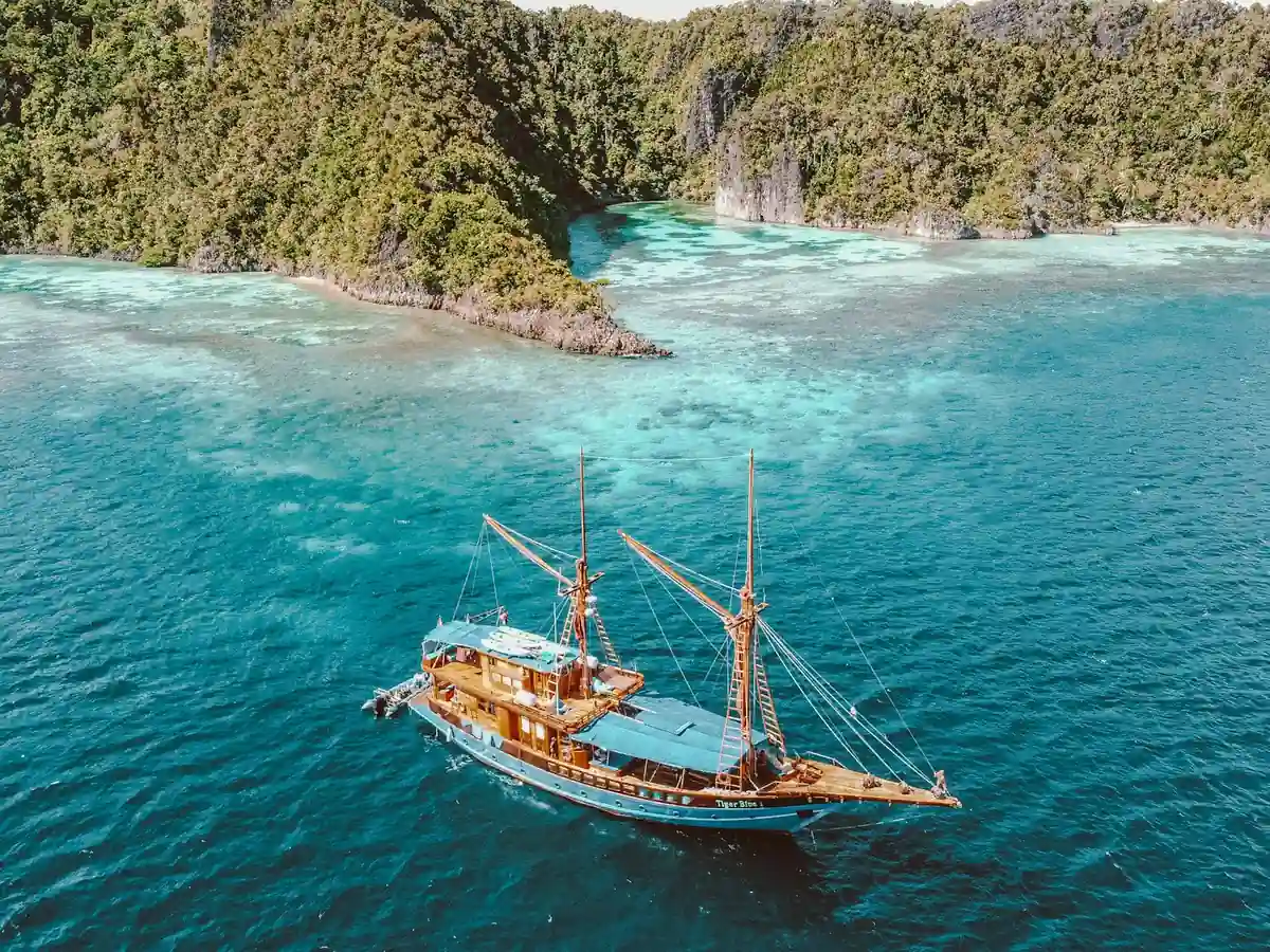 A boat at anchor in calm tropical water