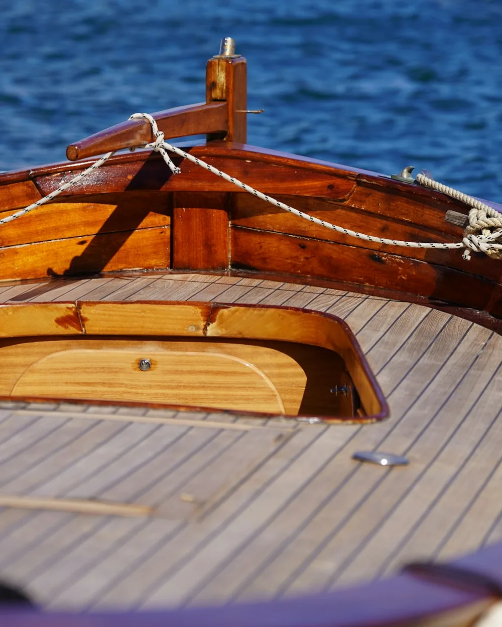 Surfboards stacked on the deck of a boat