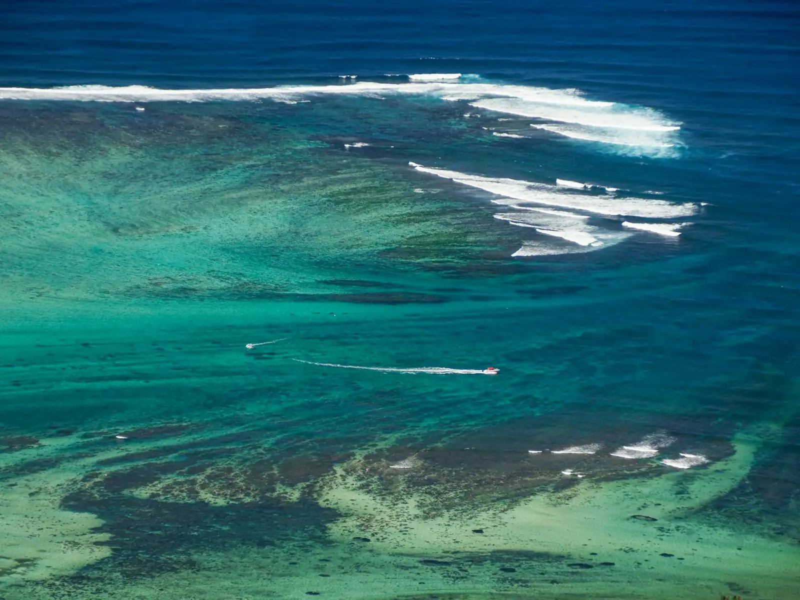 Aerial view of a Mentawai reef surf break with turquoise water