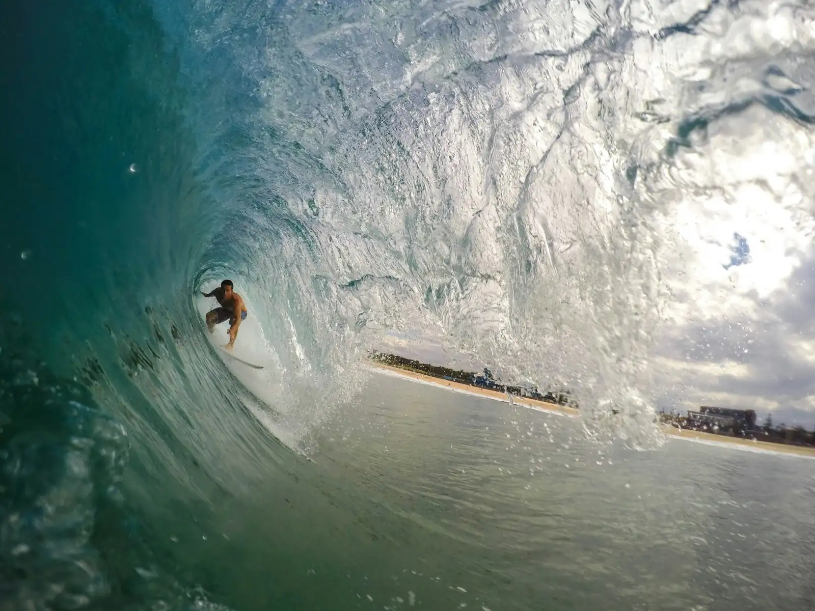 Surfer deep in a barrel at Hollow Trees (HTs), Mentawai