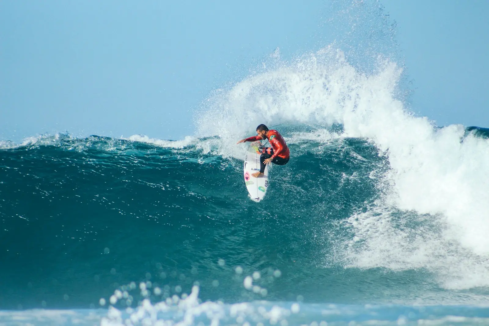 Surfer riding a wave at Rifles reef break, Mentawai