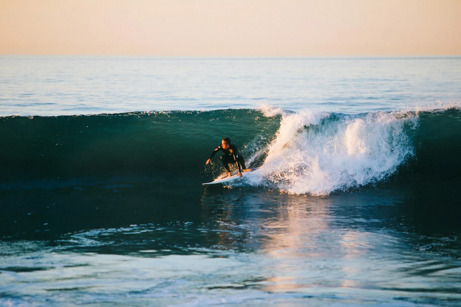 Surfer on a small wave at Burgerworld, Mentawai